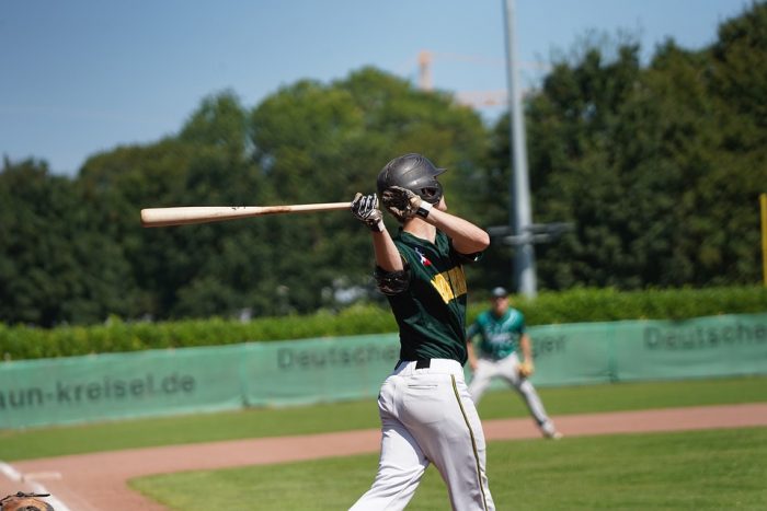 high school using wooden bat