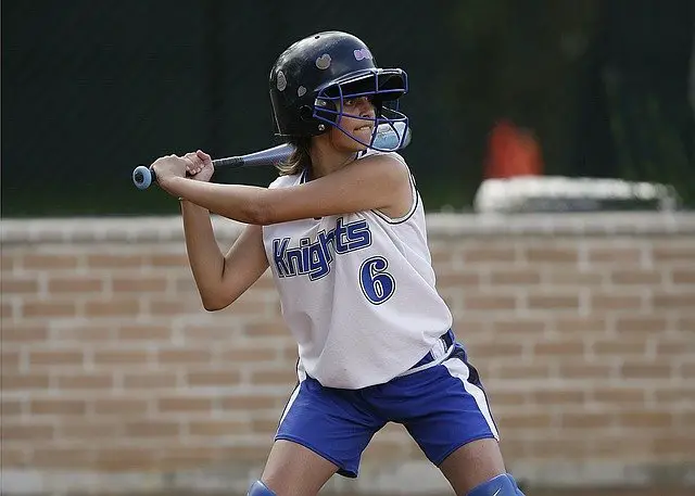 Female player with slowpitch bat