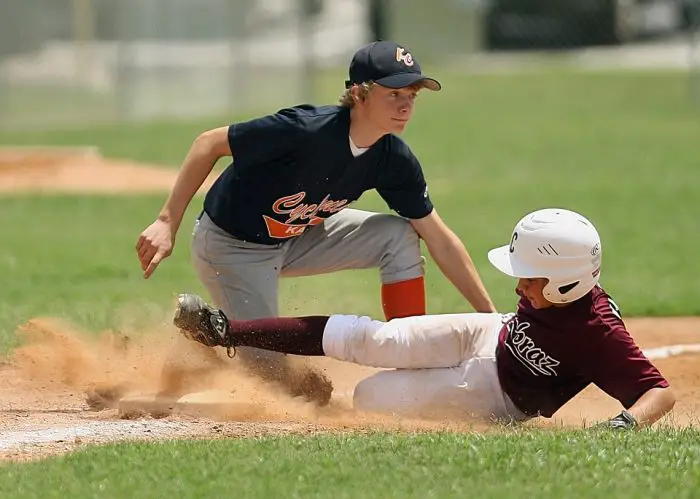 difference between football and baseball cleats