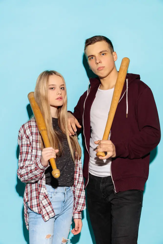 young couple with baseball bat for self defense