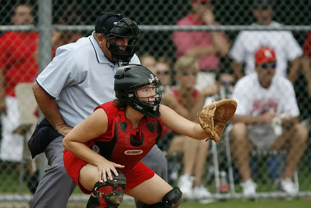 girl wearing baseball pants 